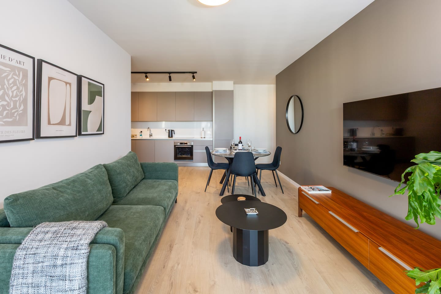 A living room and kitchen in a Sunset Gardens apartment managed by MrBNB